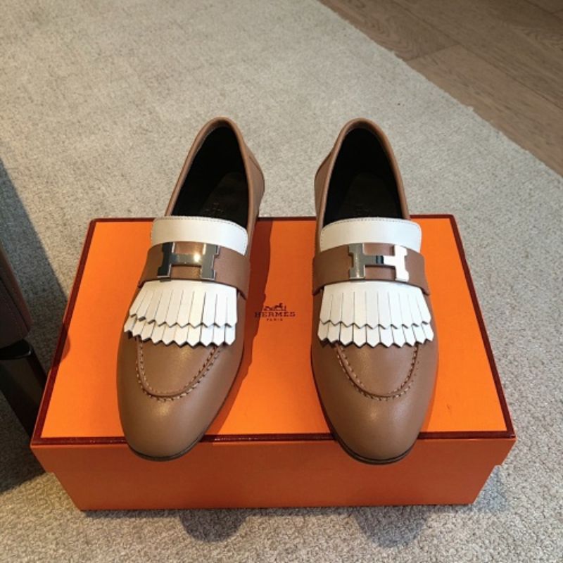Hermès Royal Loafers in a bi-color tan and white leather combination.