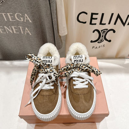 Miu Miu Suede and Shearling Sneakers.