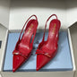 Prada Vernice Patent Leather Bow Slingback Pumps.