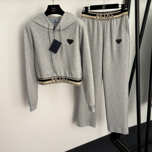 Prada gray two-piece set consisting of a cropped hoodie and matching sweatpants.