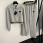 Prada gray two-piece set consisting of a cropped hoodie and matching sweatpants.