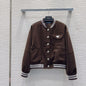 Prada varsity-style bomber jacket in a brown color.
