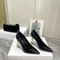 Saint Laurent Opyum pumps in black patent leather,