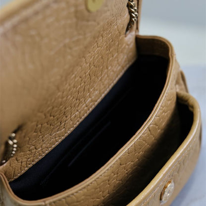 Saint Laurent Niki Flap Bag in a tan or brown pebbled leather