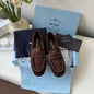 Prada Suede Driver Loafers in a rich chocolate brown ("Moro") colorway.