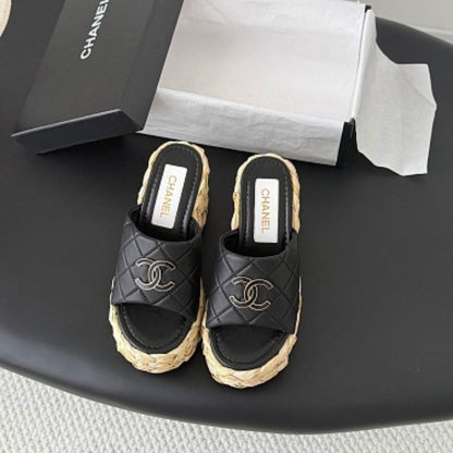 Chanel Quilted Interlocking CC Straw Platform Mules in black (noir).