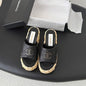 Chanel Quilted Interlocking CC Straw Platform Mules in black (noir).