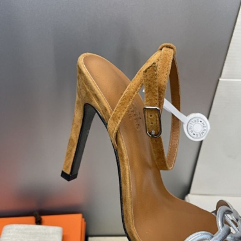 Hermès Ilot 85 Sandals in a warm gold suede and silver leather colorway.