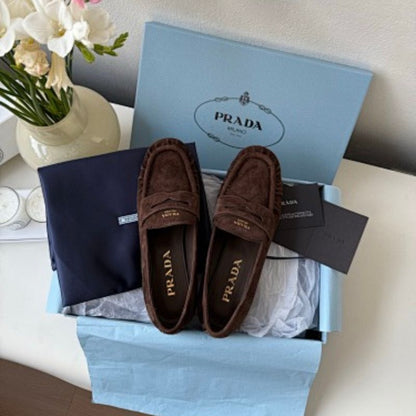 Prada Suede Driver Loafers in a rich chocolate brown ("Moro") colorway.