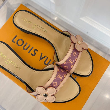 Louis Vuitton mule with a flower detail