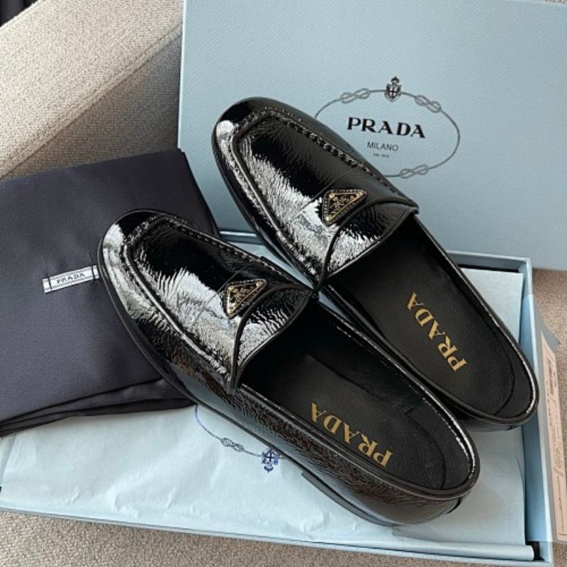 Prada Crinkled Patent Leather Loafers in classic black ("Nero").