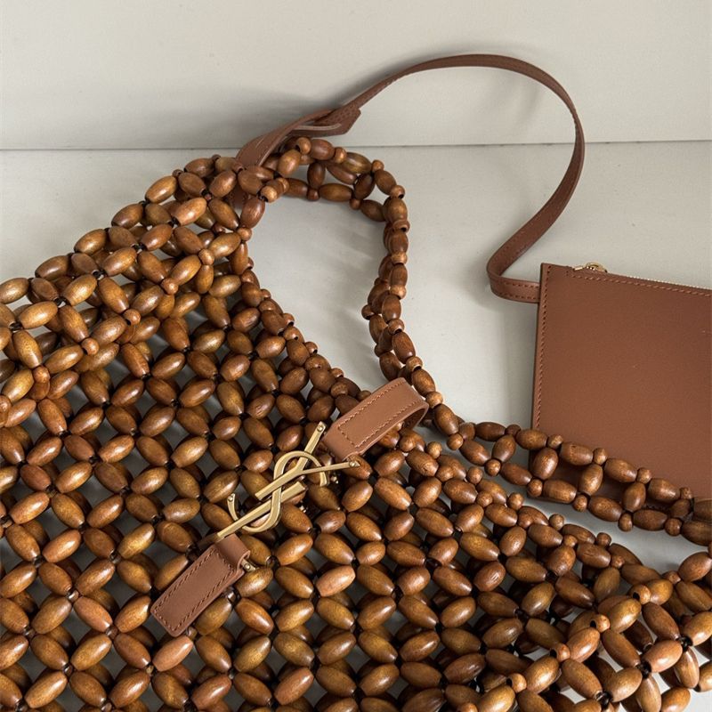 Saint Laurent Le 5 à 7 supple large bag made from wood beads.