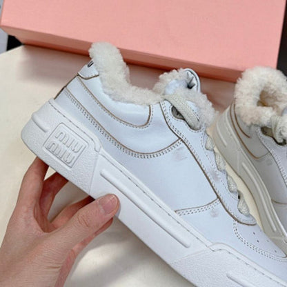 Miu Miu Shearling-Lined Sneakers.