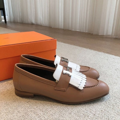 Hermès Royal Loafers in a bi-color tan and white leather combination.