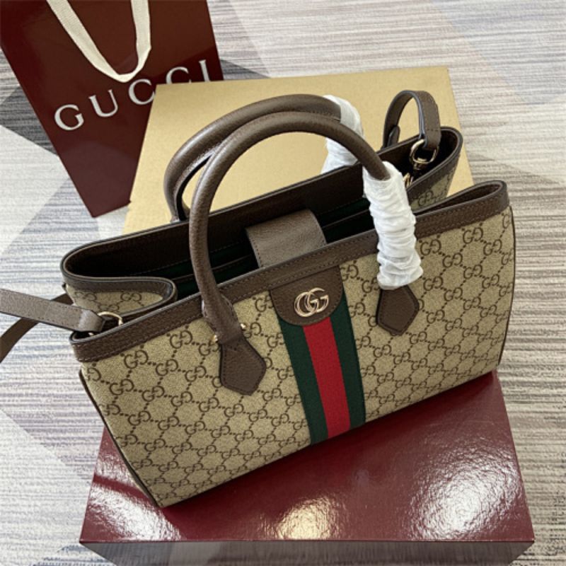 Gucci Ophidia Medium Tote Bag in GG Supreme canvas.