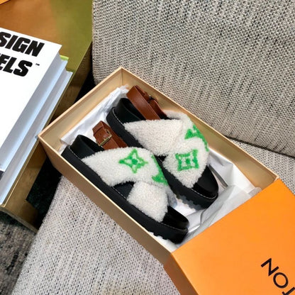 Louis Vuitton Paseo Flat Comfort Sandal with a green logo in shearling