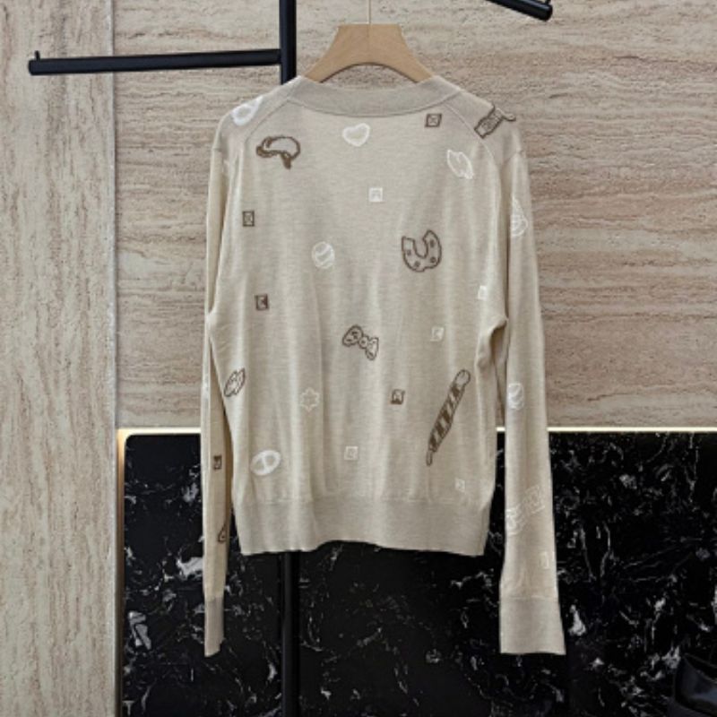 Hermès beige knitted cardigan with whimsical patches,