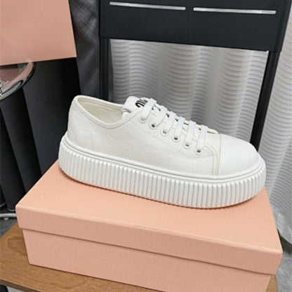Miu Miu white canvas platform sneakers.