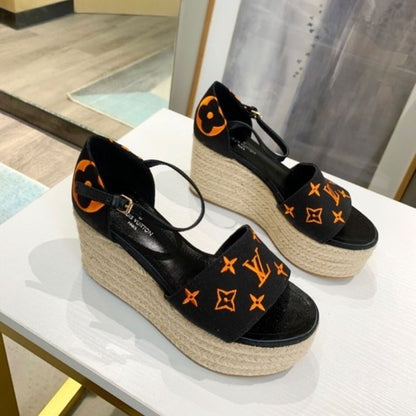 Louis Vuitton Starboard Wedge Sandal in a black and orange