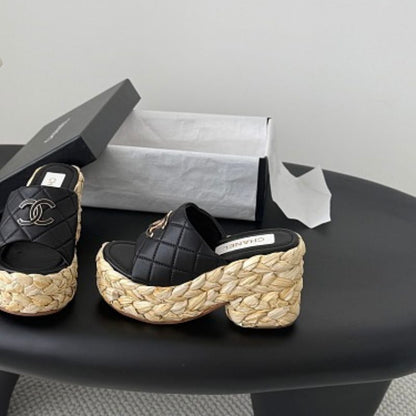 Chanel Quilted Interlocking CC Straw Platform Mules in black (noir).