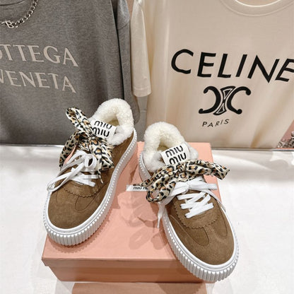 Miu Miu Suede and Shearling Sneakers.