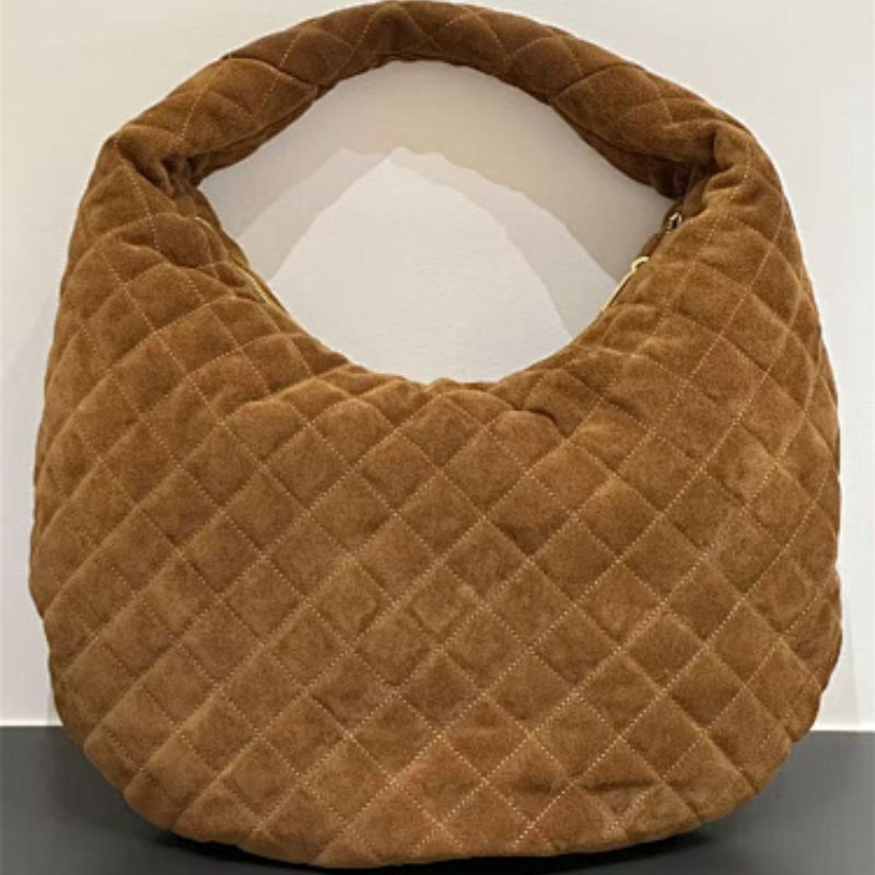 Saint Laurent Icare hobo antique gold-finished YSL maxi logo.