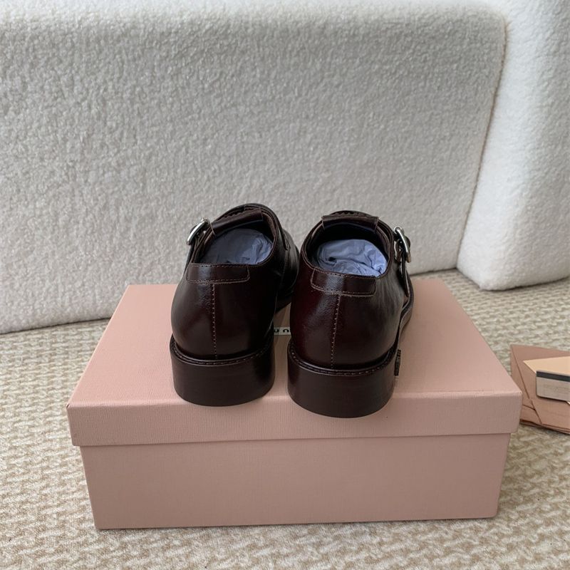 Miu Miu Buffalo Leather Buckle Loafers.