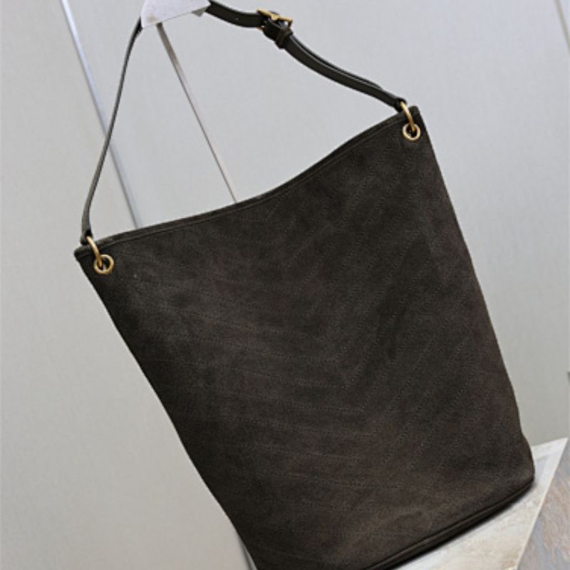 Saint Laurent Niki Supple Bucket Bag in brown quilted suede.