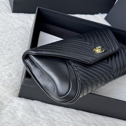 Chanel "Fold Up Again" Chevron Quilted Clutch.