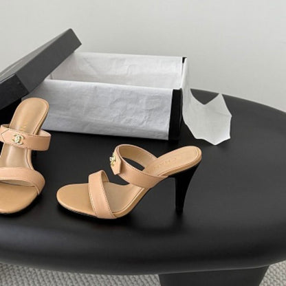 Chanel Crinkled Calfskin Double-Strap Mules in beige.
