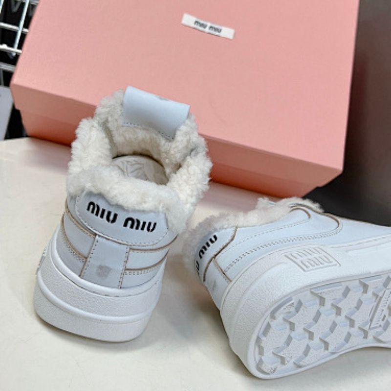 Miu Miu Shearling-Lined Sneakers.