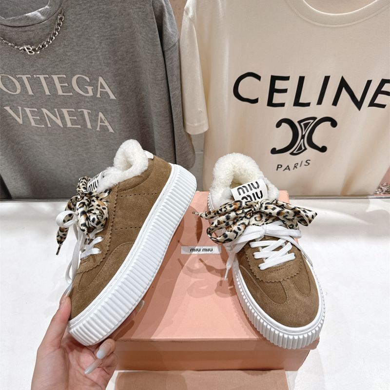Miu Miu Suede and Shearling Sneakers.