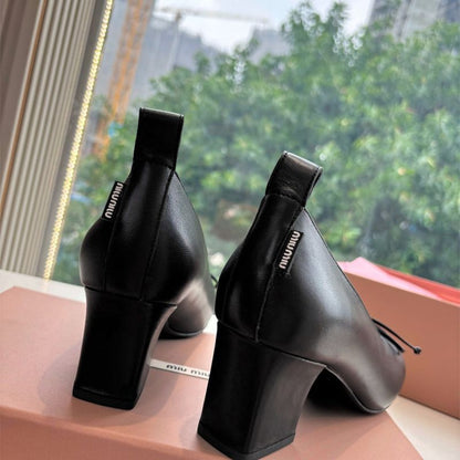 Miu Miu 65mm Bow-Detail Block-Heel Pumps in black leather