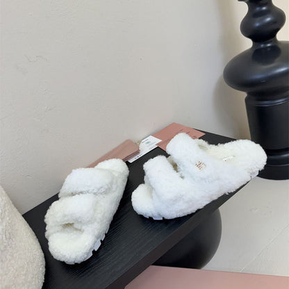 Miu Miu Natural Shearling Slides.