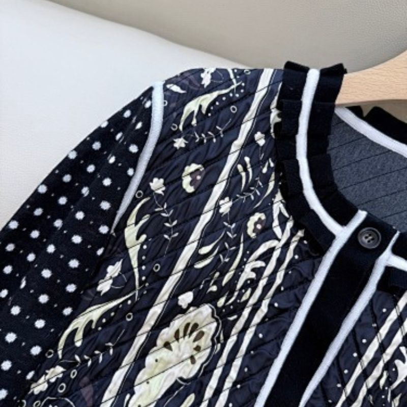 Hermès vintage-style black and white paisley knit cardigan.