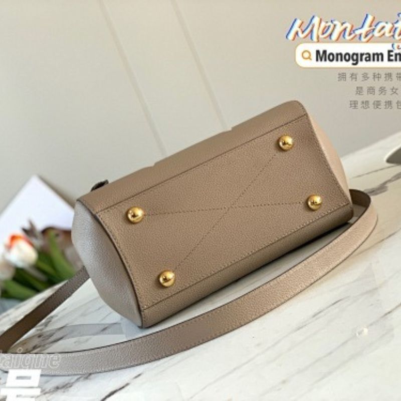 Louis Vuitton Montaigne BB in bicolor Monogram Empreinte leather.