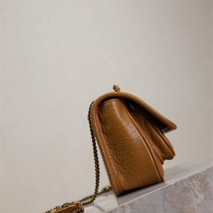 Saint Laurent Niki Flap Bag in a tan or brown pebbled leather