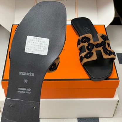 Hermès Oran sandals in a distinctive tricolor leopard-print design