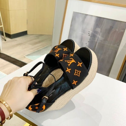 Louis Vuitton Starboard Wedge Sandal in a black and orange
