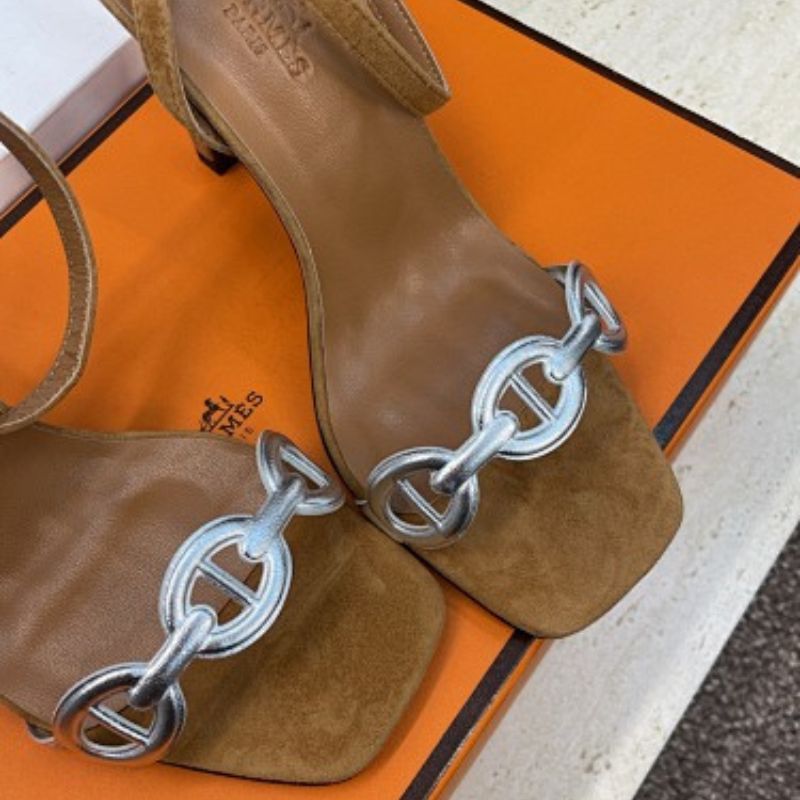 Hermès Ilot 85 Sandals in a warm gold suede and silver leather colorway.