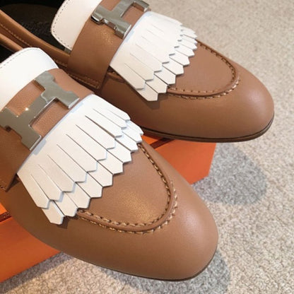 Hermès Royal Loafers in a bi-color tan and white leather combination.