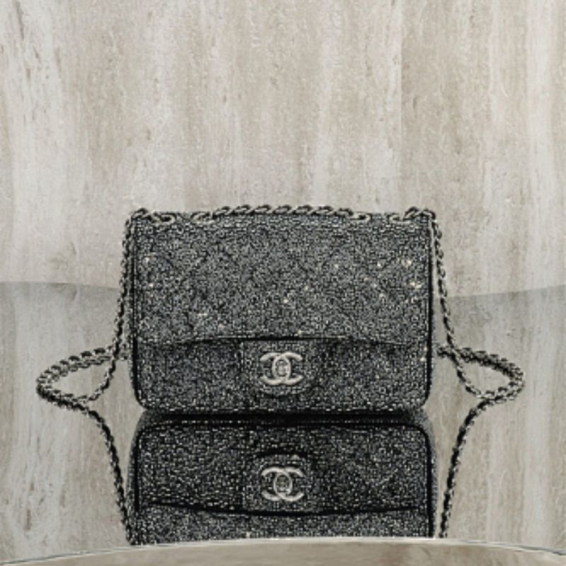 Chanel Rectangular Mini Flap Bag in black glitter.