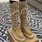 Hermès Jumping boots (specifically the lace-up, knee-high variation).