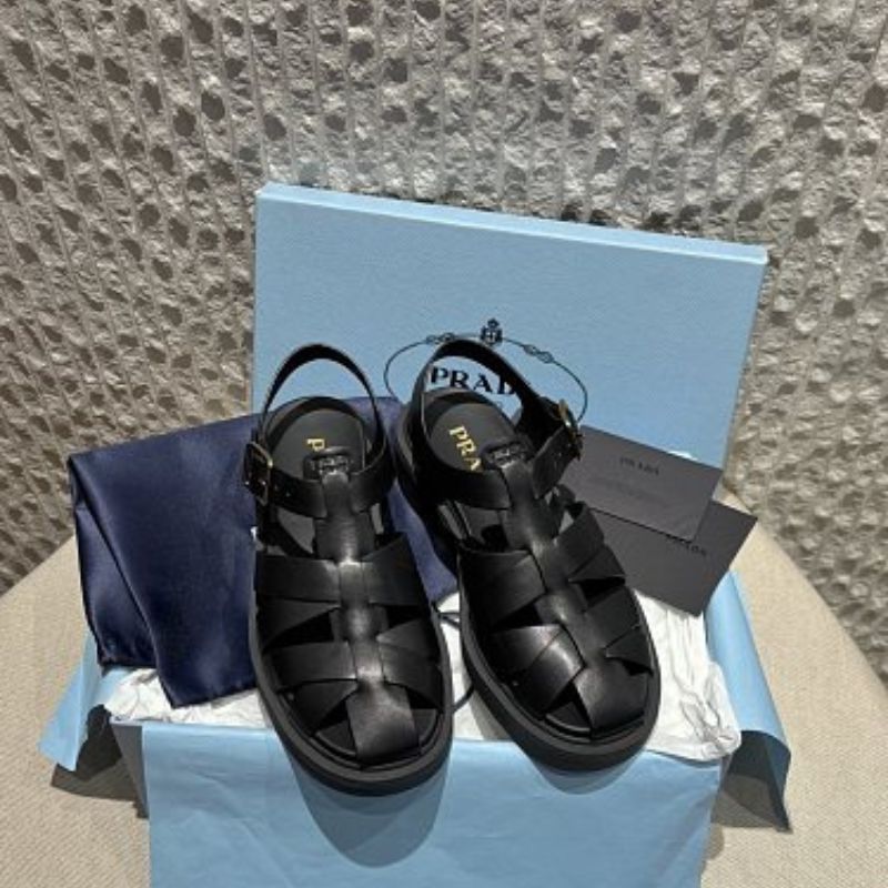 Prada Soft Leather Fisherman Cage Sandals in black.