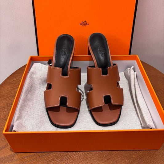 Hermès Oasis Sandals, the elegant heeled counterpart to the iconic Oran flat.