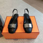Hermès Innocente Slingback Flats in noir (black) leather,