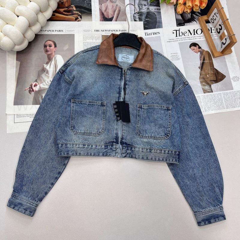 Prada cropped denim jacket with a brown leather collar.