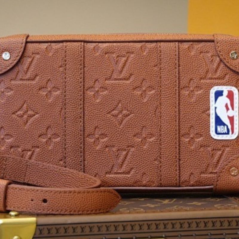 Louis Vuitton x NBA Soft Trunk Wearable Wallet in Ball Grain Leather.