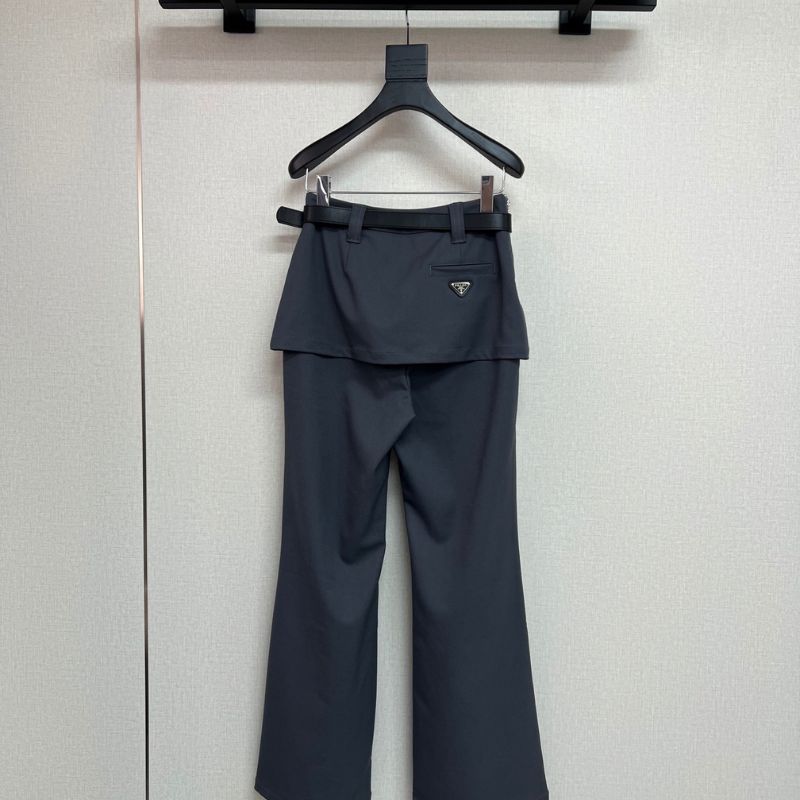 Prada layered trousers with a wrap-around skirt overlay.