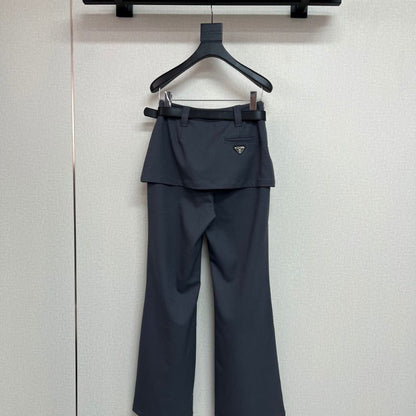 Prada layered trousers with a wrap-around skirt overlay.
